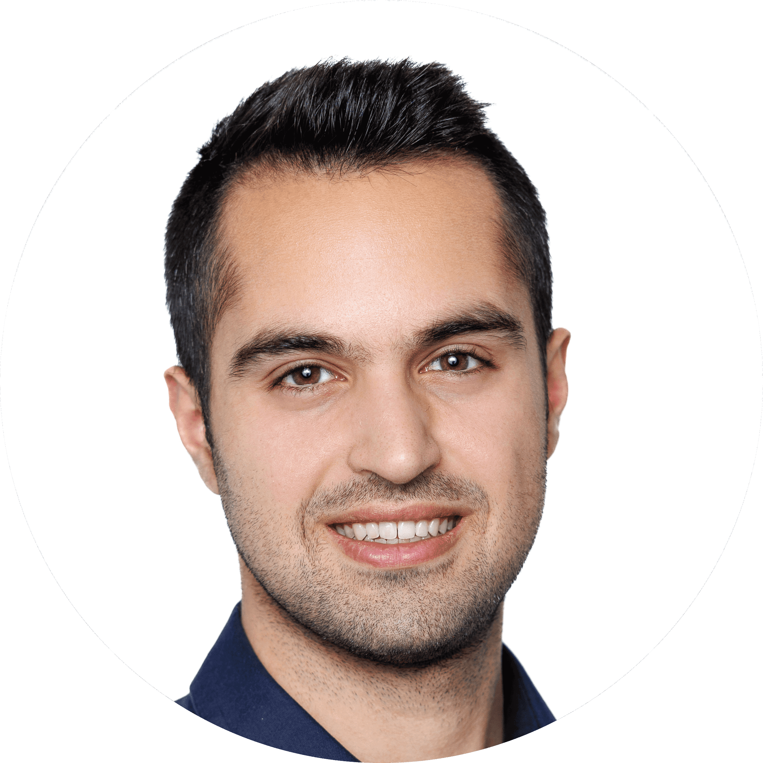 Smiling young man with short dark hair and trimmed beard, wearing a dark shirt, against a plain white background—perfectly capturing the approachable and professional atmosphere often found at Brooklyn Therapy or with a skilled therapist NYC.